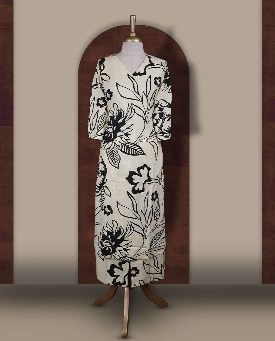 Ivory colour coord set with bold black floral prints, featuring a V neck and 3/4 sleeves, Paired with matching straight pants, it blends elegance and comfort for a chic everyday or casual outing look.