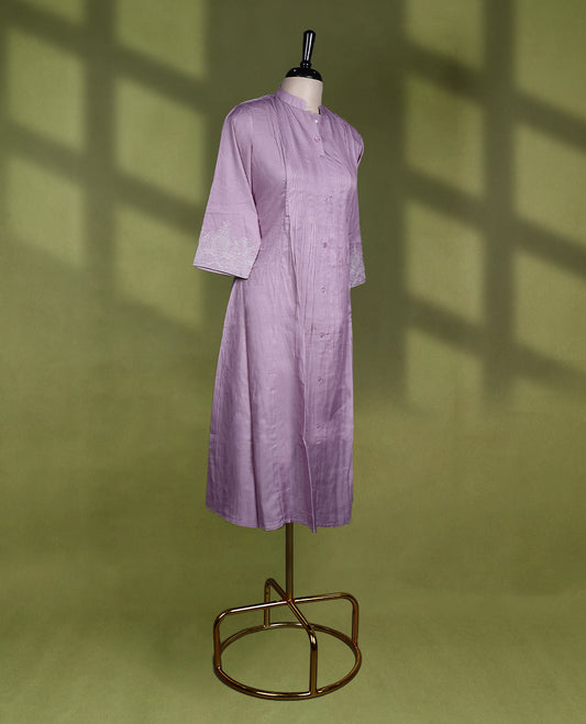 Sophisticated lavender colour kurti with a mandarin collar, vertical pintucks, button down front, and 3/4th sleeves adorned with delicate embroidery.