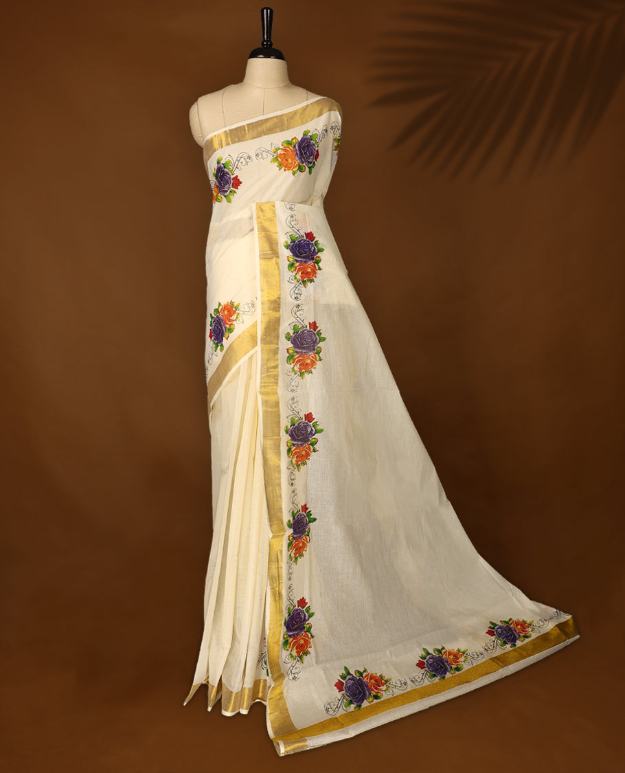 Elegant off white colour cotton Kerala saree with vibrant floral embroidery, golden zari border, and delicate pallu work, Perfect for festive occasions & paired with matching blouse for traditional events, or cultural celebrations.