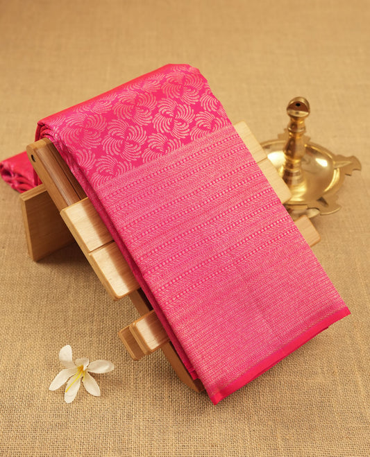 Rani pink colour Kanchipuram pattern Manthrakodi saree featuring geometrical design antique gold zari jacquard design across the body, turning zari border, and plain jacquard blouse piece.