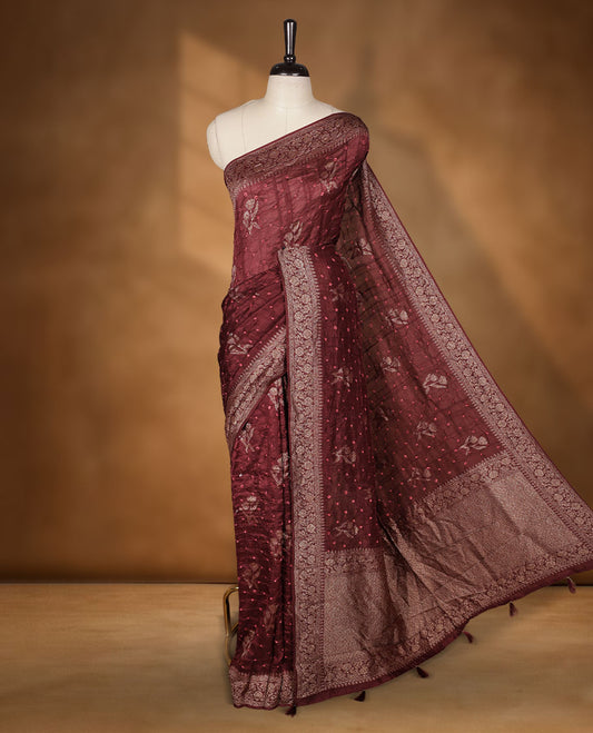Deep brown colour Banarasi Bandhani silk saree featuring with intricate Banarasi motifs on body, complemented by antique zari woven border and grand pallu, paired with matching  blouse