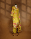 Mustard yellow colour salwar from TWARA, featuring a V-neck adorned with cut beads, sequins, and thread work, with digital floral prints on the top, paired with a matching bottom and a digital printed dupatta.