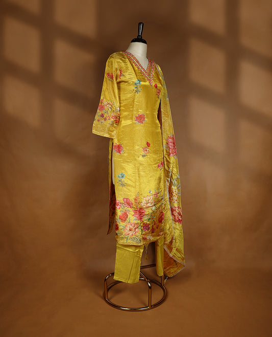 Mustard yellow colour salwar from TWARA, featuring a V-neck adorned with cut beads, sequins, and thread work, with digital floral prints on the top, paired with a matching bottom and a digital printed dupatta.