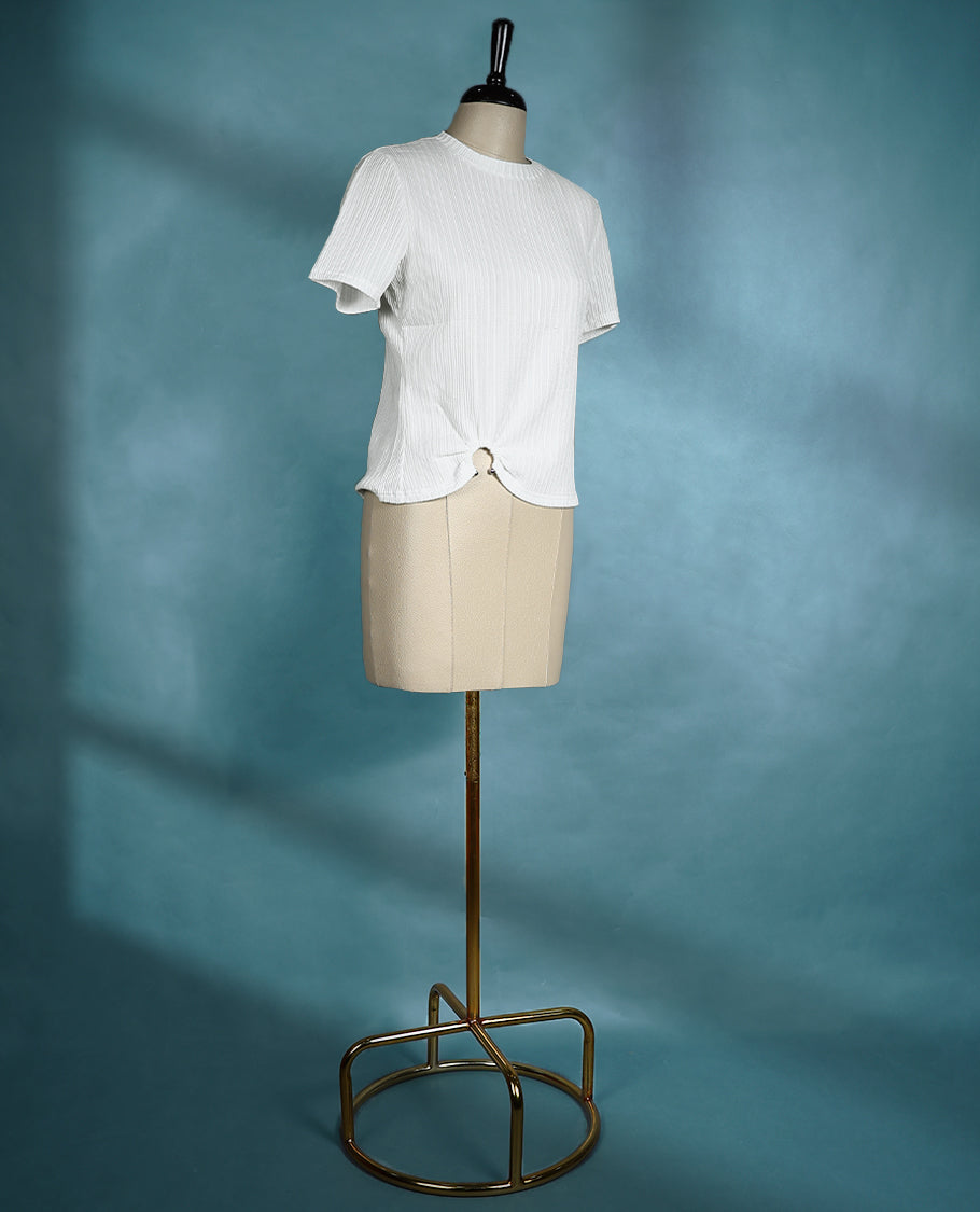 White textured short sleeve top featuring a crew neck and a front ring detail for a subtle, stylish twist.