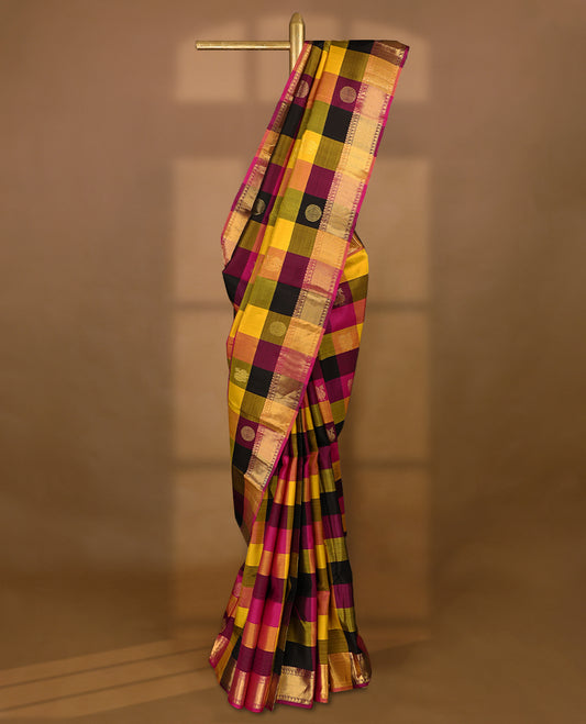 Pink, yellow, and black Checked pure traditional Kancheepuram silk saree adorned with antique zari Chakkram motifs on the body, elegantly complemented by a traditional mango design border, and paired with a matching blouse.