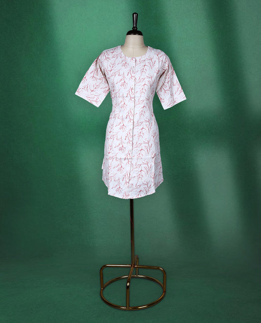Beige colour cotton kurti adorned with delicate red leaf prints, featuring a round neckline, short sleeves, and a straight cut silhouette a breezy and elegant pick for casual and daily wear.
