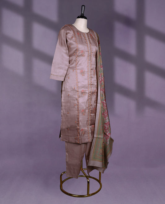 Taupe colour kurti set features a round neckline and 3/4th sleeves, adorned with vertical thread embroidery and floral motifs, beautifully complemented by self colour Bottom & a richly woven multicolor dupatta.