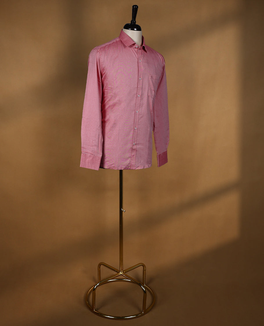Dusty rose DH men’s shirt crafted in a glossy soft textured fabric featuring a rich sheen, classic collar, full sleeves, and chest pocket perfect for festive and elegant occasions