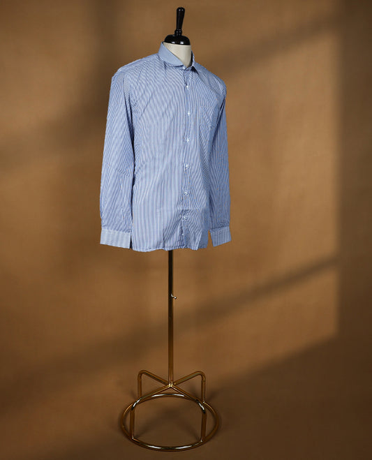 Sky blue Peter Eglend men's formal shirt in a soft cotton blend, featuring fine white vertical pinstripes, full sleeves with contrast cuffs, classic collar, and a chest pocket.