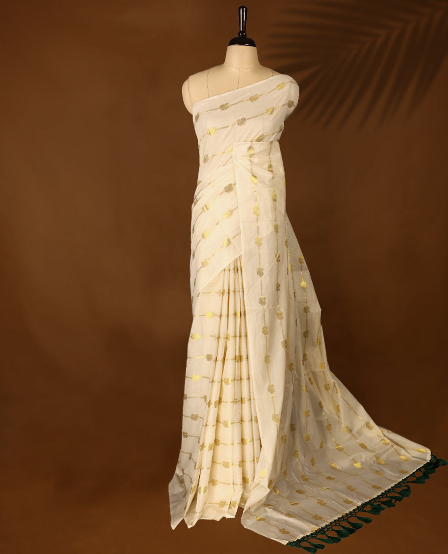 Light Gold colour Cotton Kerala saree featuring gold zari Stripes with peacock motifs on body, without border, paired with a matching blouse perfect for festive occasions.