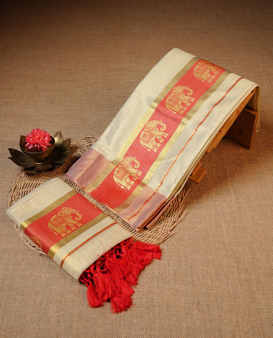 Golden colour Tissue silk set mundu features a plain body accented by a Elephant print on gold zari border.