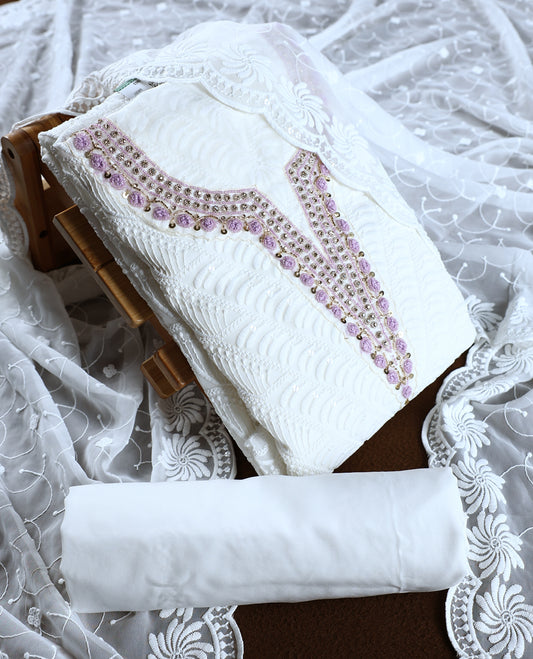 White colour churidhar material featuring delicate embroidery with violet colour sequins and bead highlights, paired with a plain white bottom & Comes with a matching embroidered net dupatta.