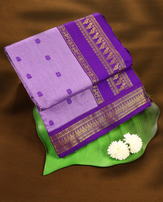 Lavender colour mixed Kalyani cotton saree featuring Purple zari motifs throughout the body, paired with Purple colour traditional border and pallu, with matching blouse
