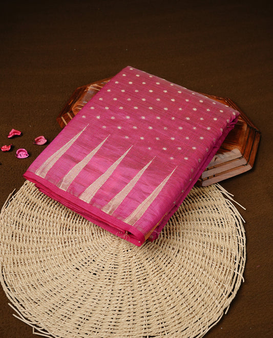 Rani pink colour semi tussar silk saree featuring gold zari dot motifs all over the body, highlighted by a self colour border with intricate gold zari temple patterns. Comes paired with a matching blouse piece.