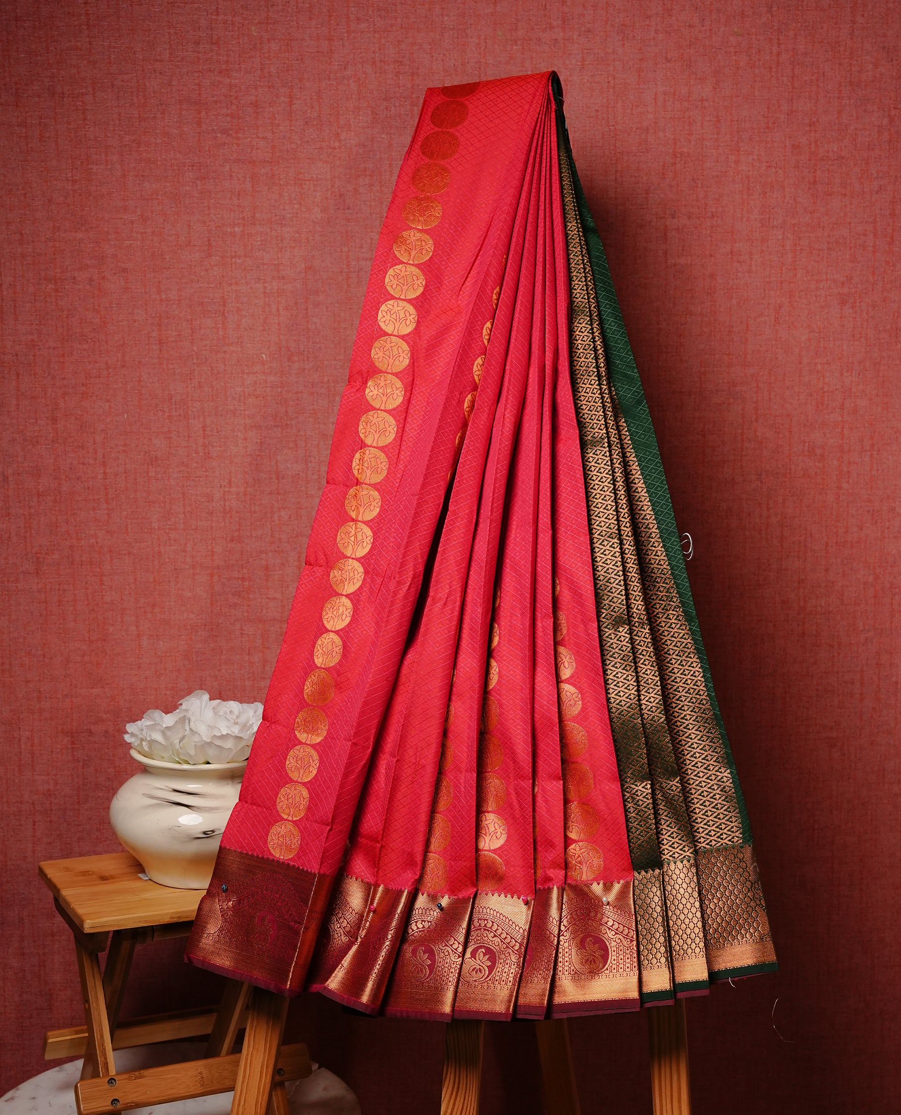 Orange Pink colour Semi silk saree Featuring Cream colour patterns on body, complemented by contrast Maroon colour with gold zari border, paired with matching blouse piece.