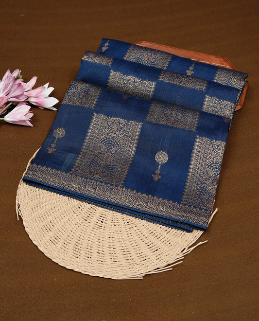 Teal colour Tussar Banaras Georgette silk saree featuring Antique zari Box Pattern on body, complemented by self colour border with zari border, paired with matching blouse piece.