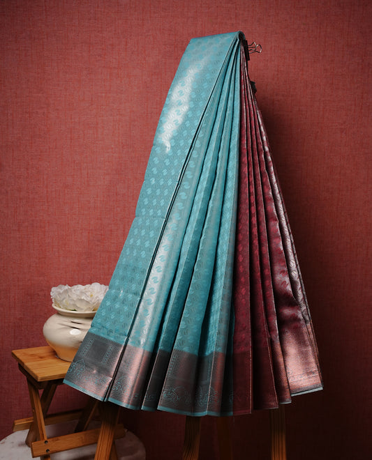Aqua cyan colour Semi silk saree Featuring silver zari motifs on body, complemented by Self colour with Antique zari border, paired with matching blouse piece.