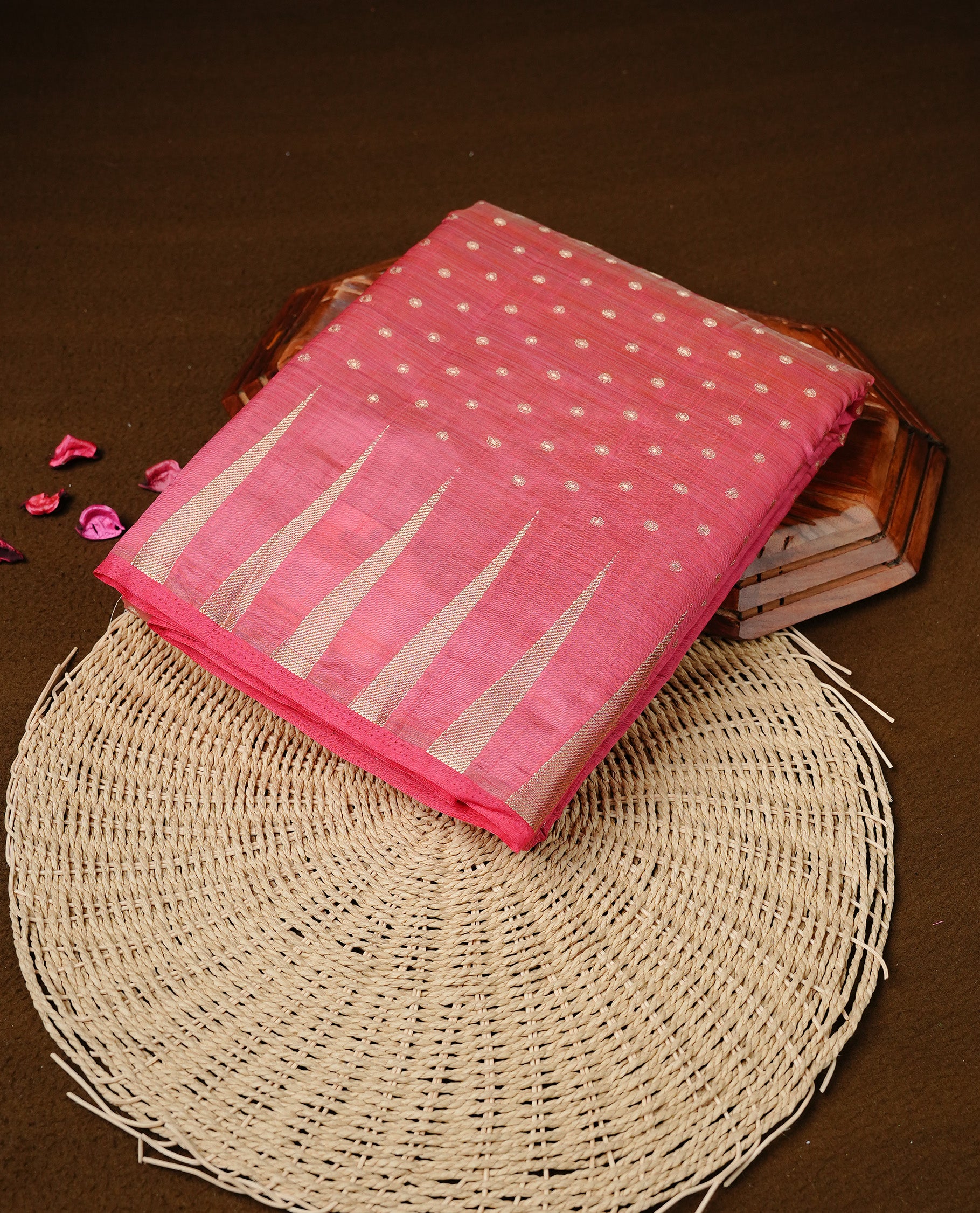 Pink colour semi tussar silk saree featuring gold zari dot motifs all over the body, highlighted by a self colour border with intricate gold zari temple patterns. Comes paired with a matching blouse piece.