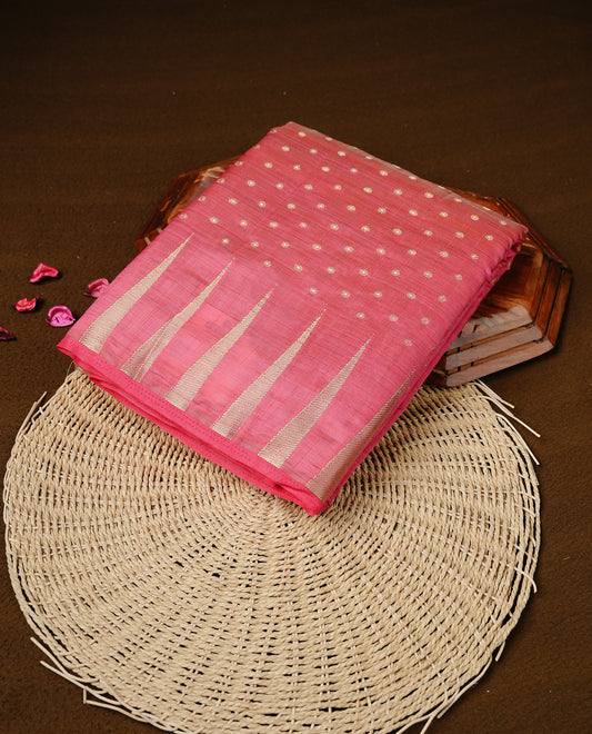 Pink colour semi tussar silk saree featuring gold zari dot motifs all over the body, highlighted by a self colour border with intricate gold zari temple patterns. Comes paired with a matching blouse piece.