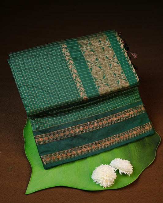 Green colour kalyani cotton saree featuring gold zari check pattern on body, complemented by Self colour with Antique zari border, paired with matching blouse piece.