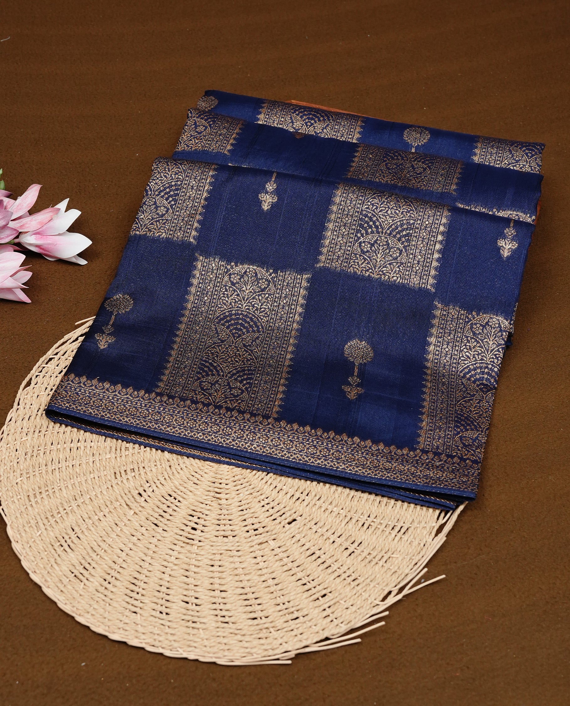 Navy Blue colour Tussar Banaras Georgette silk saree featuring Antique zari Box Pattern on body, complemented by self colour border with zari border, paired with matching blouse piece.