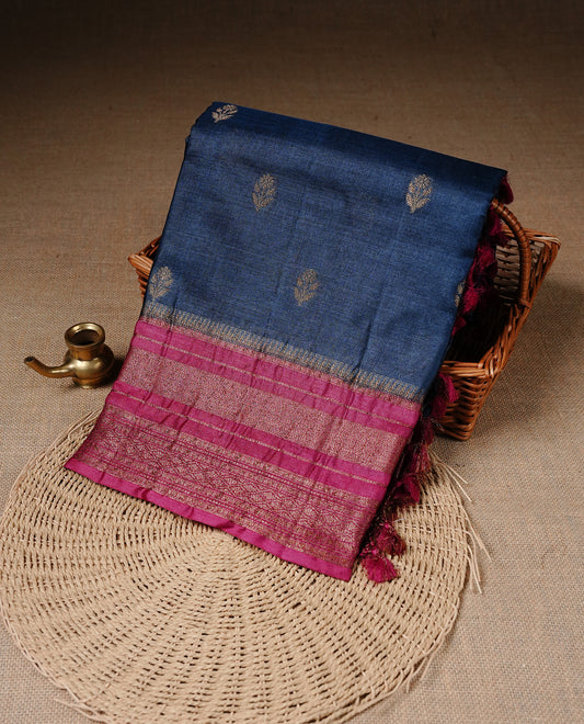 Blue colour Pure Banaras Tussar silk saree Featuring Gold zari buttas on body, complemented by Contrast Magenta colour with zari border, paired with matching blouse piece.