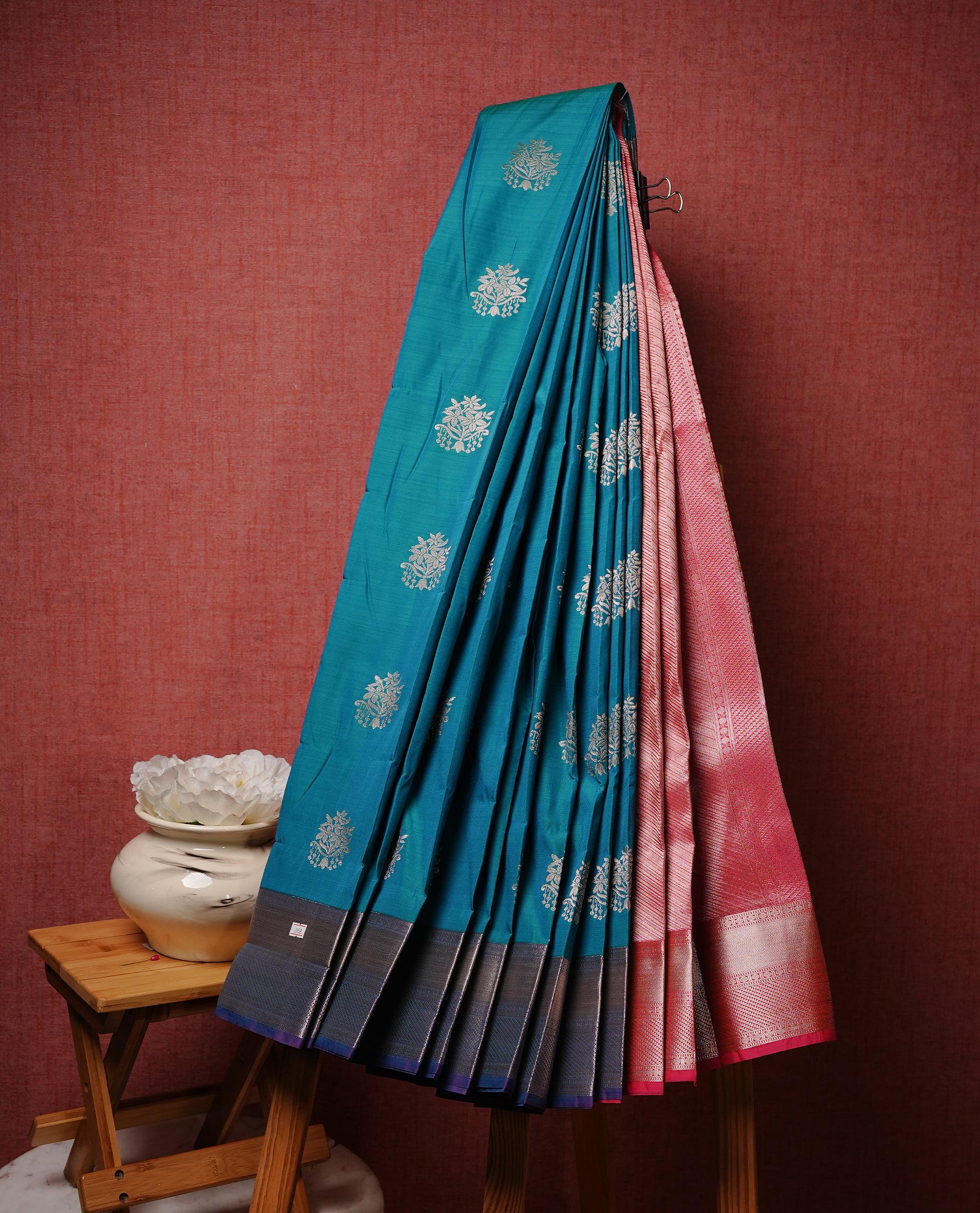 Green colour Semi silk saree Featuring gold zari motifs on body, complemented by contrast Peacock colour with gold zari border, paired with matching blouse piece.