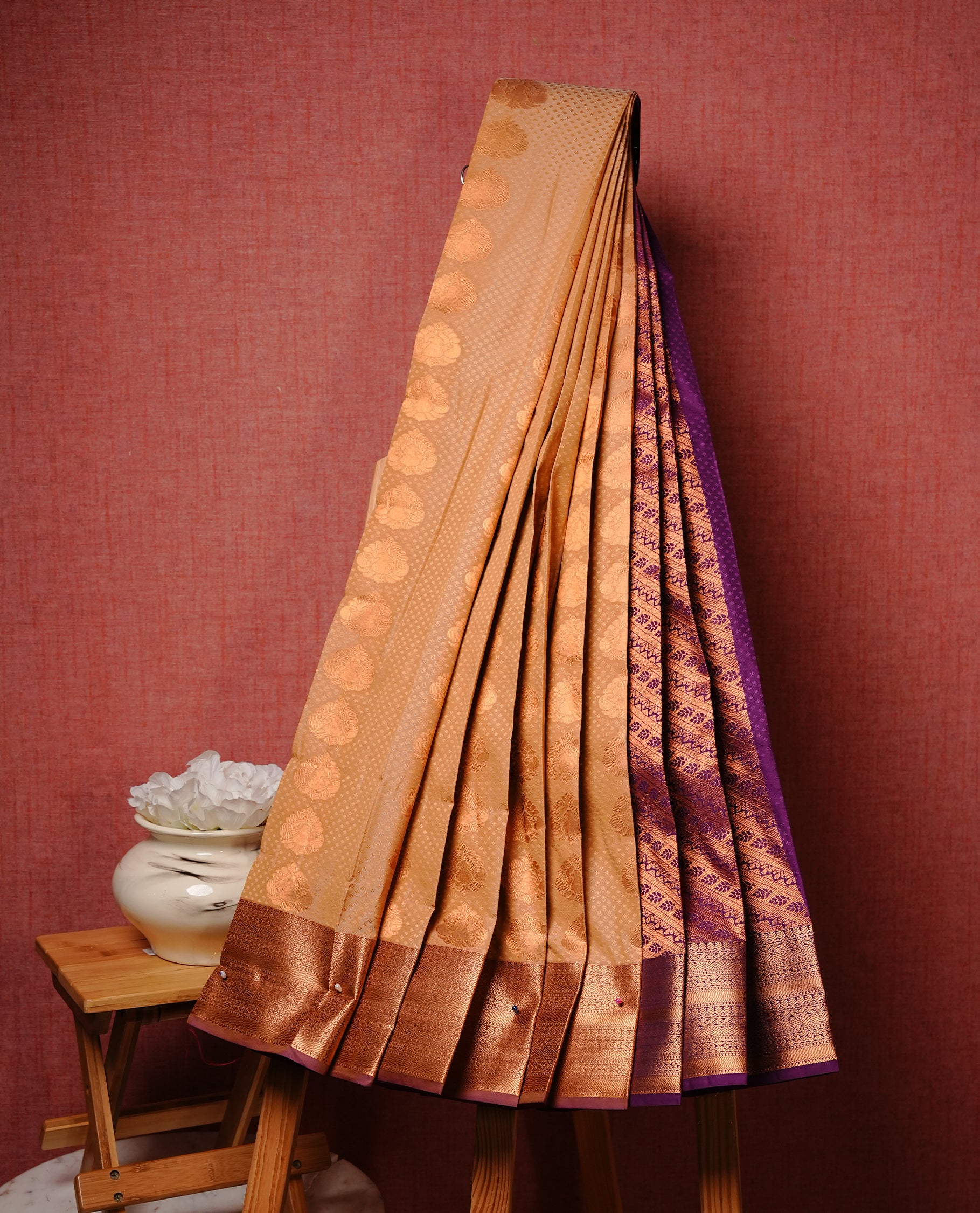 Beige colour Semi silk saree Featuring gold zari motifs on body, complemented by contrast Pastel maroon colour with gold zari border, paired with matching blouse piece.