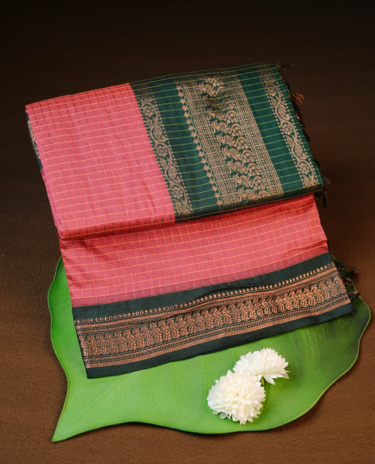Pinkish peach colour kalyani cotton saree featuring gold zari check pattern on body, complemented by green colour with Antique zari border, paired with matching blouse piece.