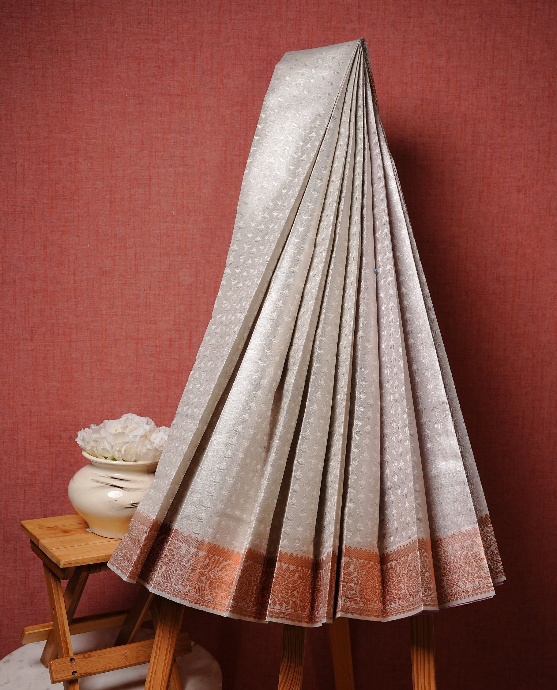 Silver colour Semi silk saree Featuring Cream colour patterns on body, complemented by Self colour with Antique zari border, paired with matching blouse piece.