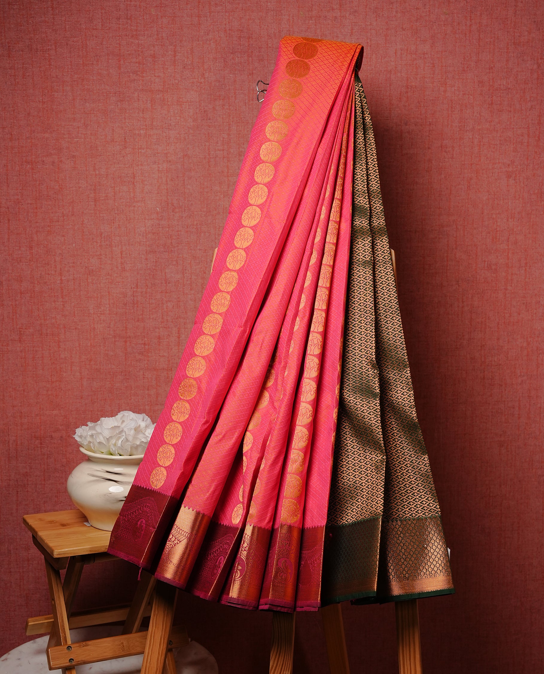 Pink colour Semi silk saree Featuring Gold zari motifs on body, complemented by contrast Maroon colour with gold zari border, paired with matching blouse piece.