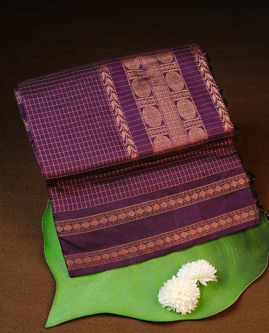 Grape colour kalyani cotton saree featuring gold zari Check pattern on body, complemented by self colour with Antique zari border, paired with matching blouse piece.