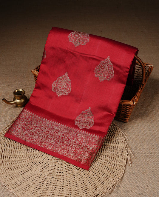 Red Colour Pure Banaras Soft Silk saree featuring Antique Zari buttas in body, complemented by zari work on self colour border, paired with matching Blouse Piece.