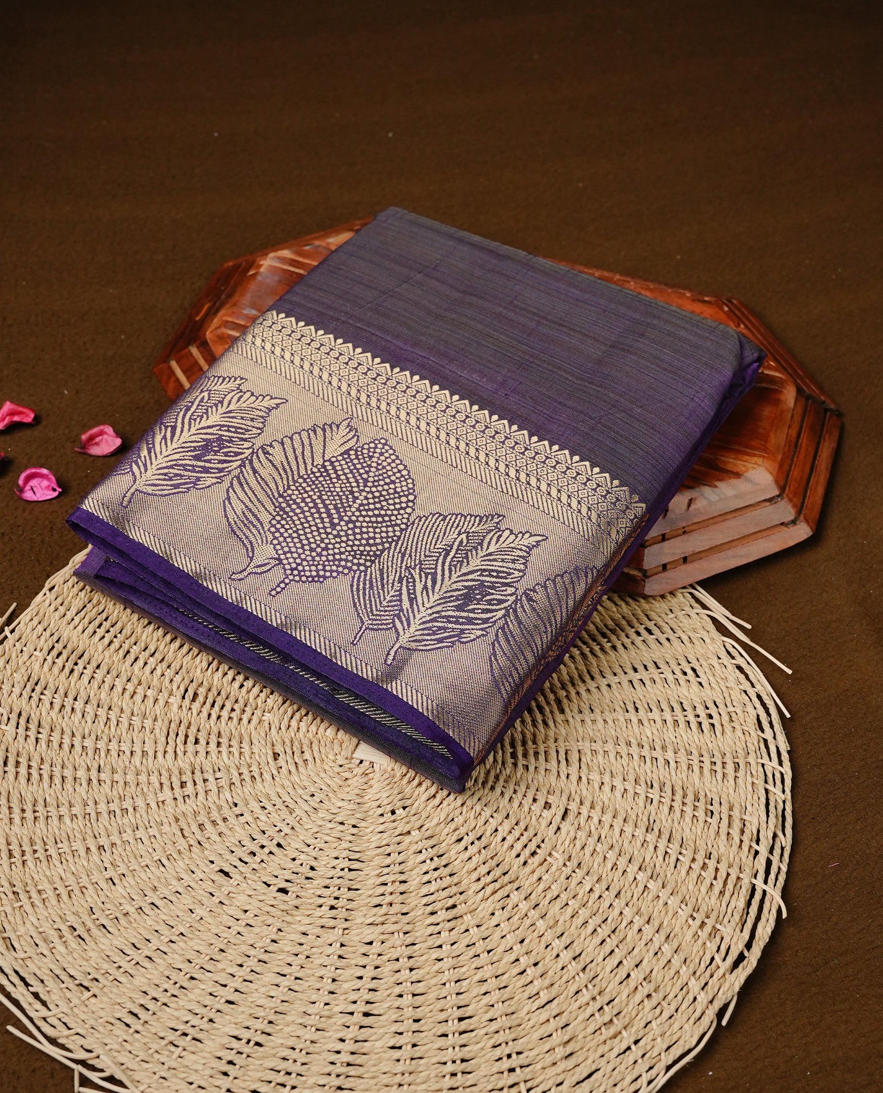 Purple colour semi tussar silk saree featuring an elegant plain body with traditional gold zari detailed border for a refined look. Comes paired with a matching blouse piece.