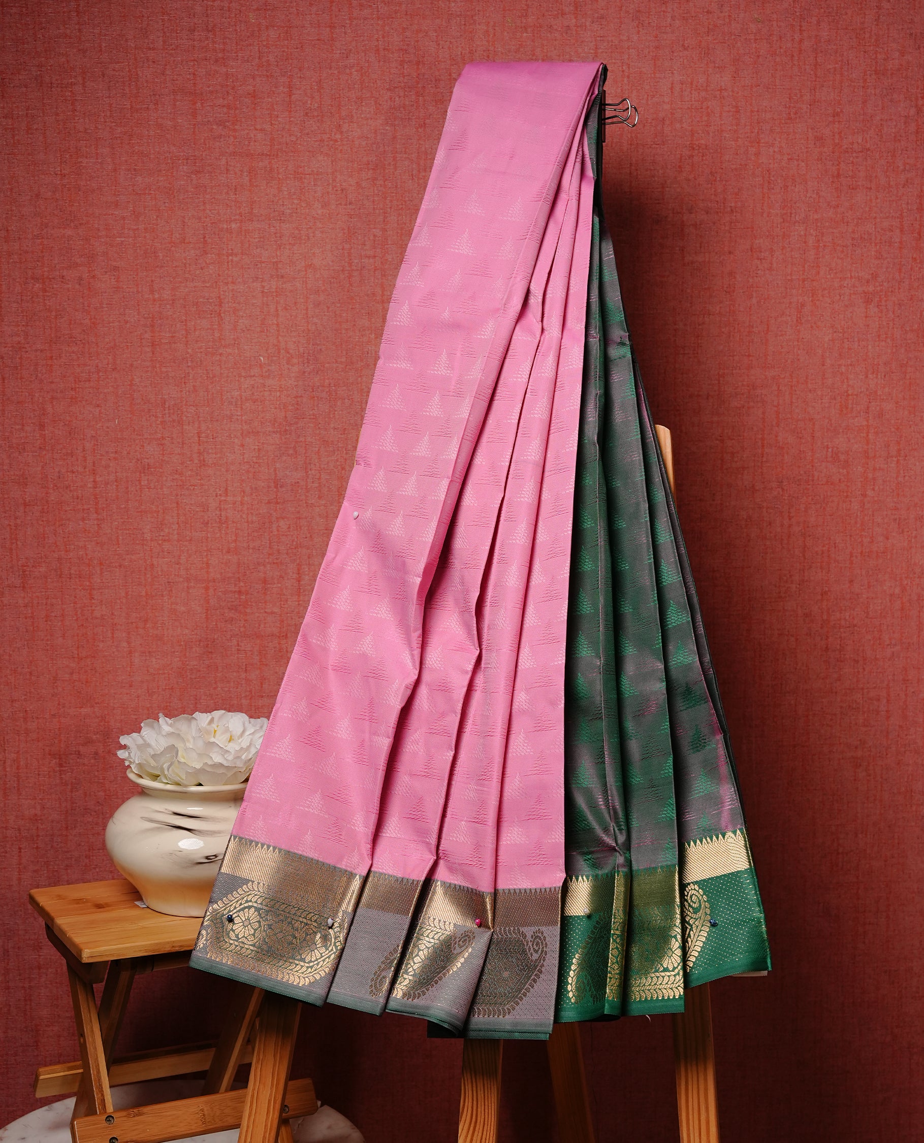 Pink colour Semi silk saree Featuring gold zari motifs on body, complemented by contrast purple colour with gold zari border, paired with matching blouse piece.