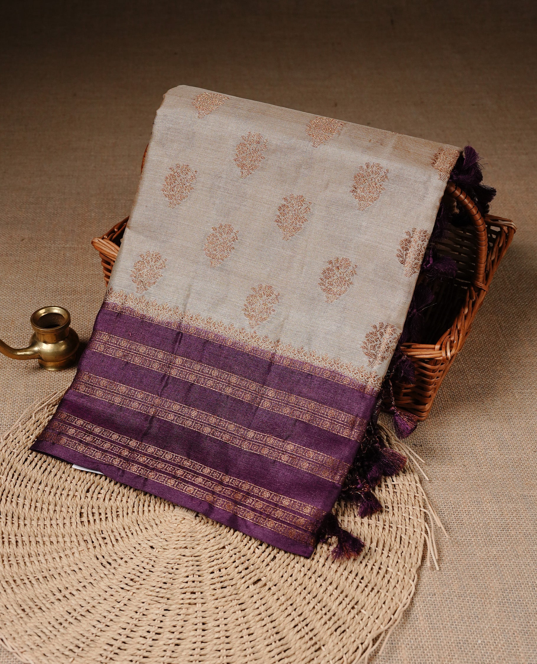 Golden Cream Colour Banaras tussar silk saree featuring Antique zari Motifs on body, Complemented by Burgundy colour variant with zari border, paired with matching blouse Piece.