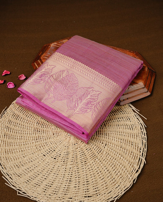 Pink colour semi tussar silk saree featuring an elegant plain body with traditional gold zari detailed border for a refined look. Comes paired with a matching blouse piece.