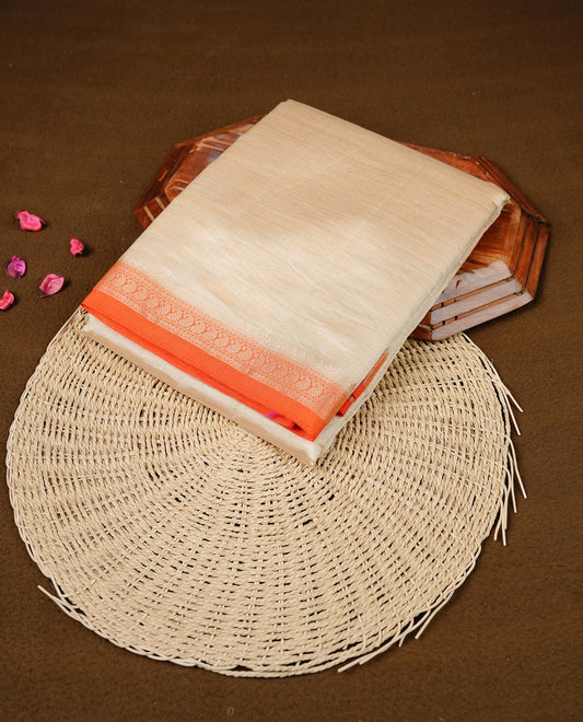 Cream colour Semi Tussar silk saree featuring an elegant plain body, accentuated by a contrast Orange border adorned with intricate gold Mango zari work, paired with a matching blouse piece.