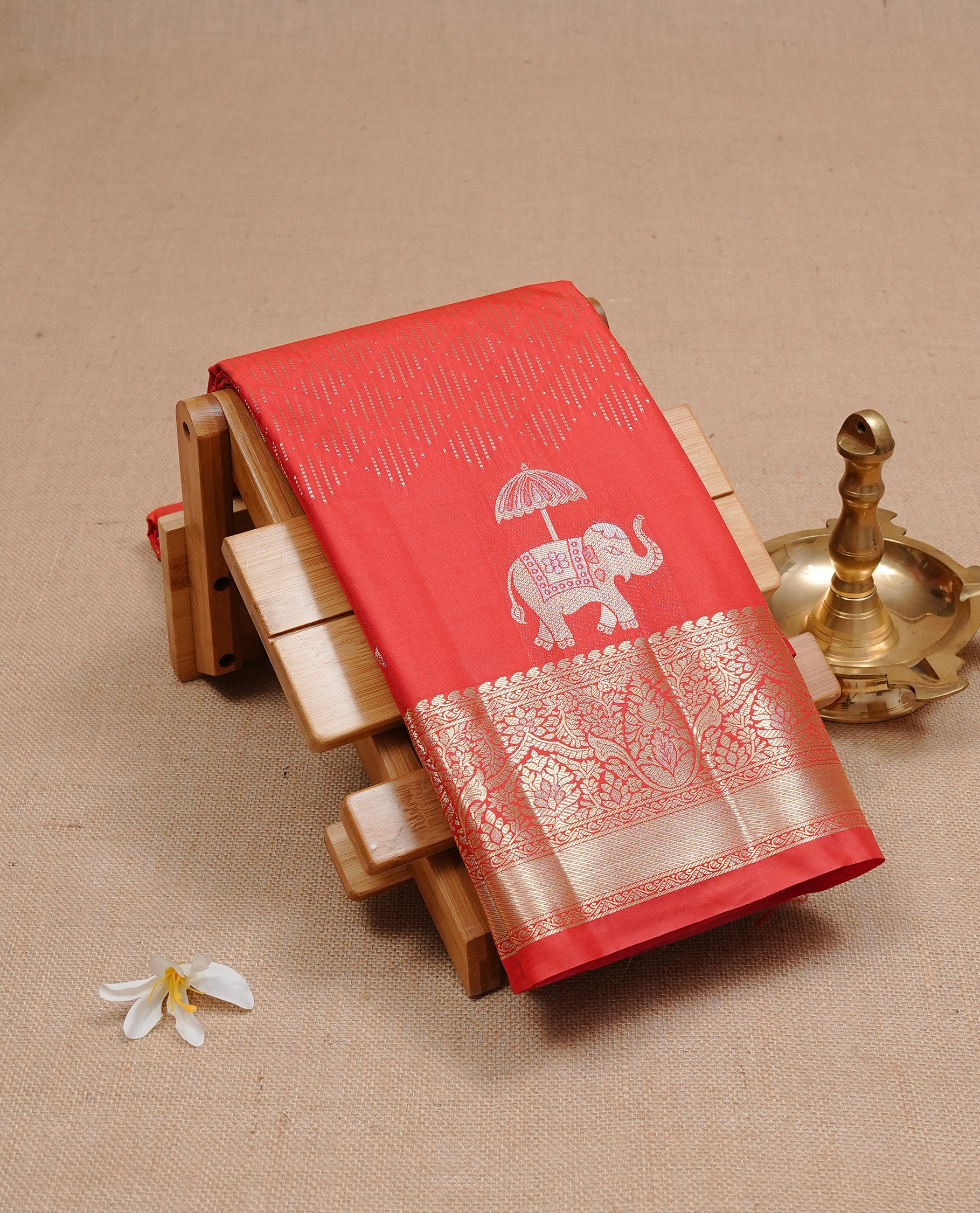 Pink Red colour semi wedding silk saree featuring Gold zari pattern on body, complemented Silver Elephant motifs & gold zari border, paired with matching blouse piece.