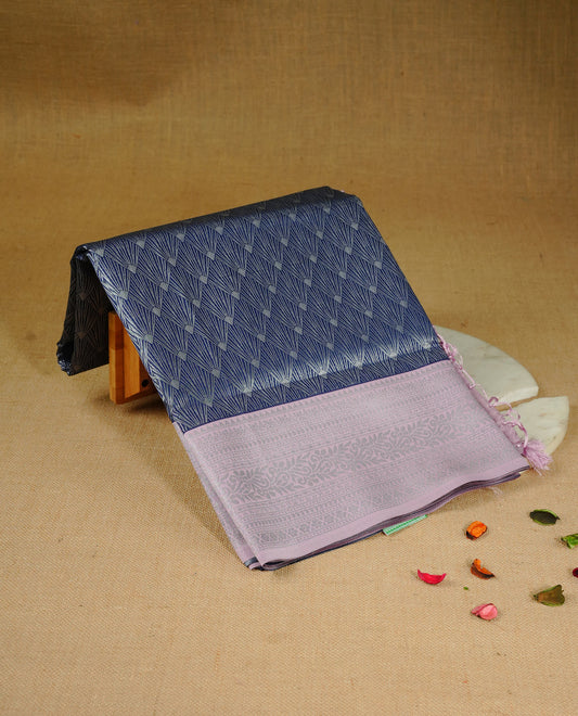 Navy blue colour semi silk saree featuring Silver zari Design pattern on body, complemented by contrast Pink colour with silver zari border, comes with matching blouse piece
