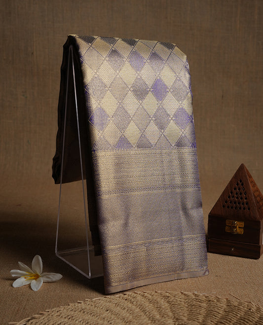 Indigo & gold double shade colour kancheepuram tissue silk saree highlighting gold Geometric zari pattern body, with self colour colour with traditional border and paired with matching blouse.