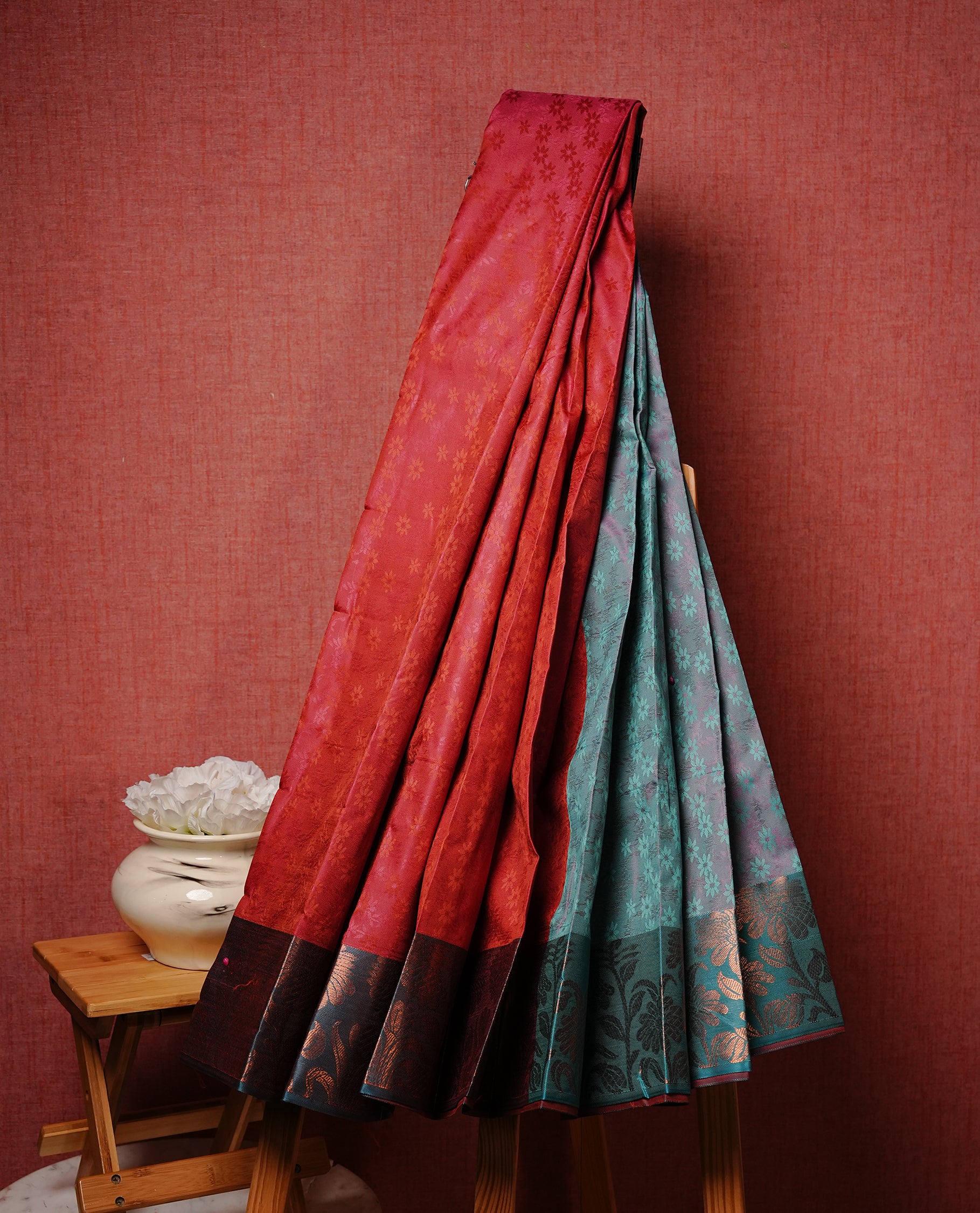 Rouge colour Semi silk saree Featuring self colour zari motifs on body, complemented by contrast green colour with gold zari border, paired with matching blouse piece.