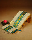 Light gold tissue set mundu featuring Teal colour print on kasav kara.