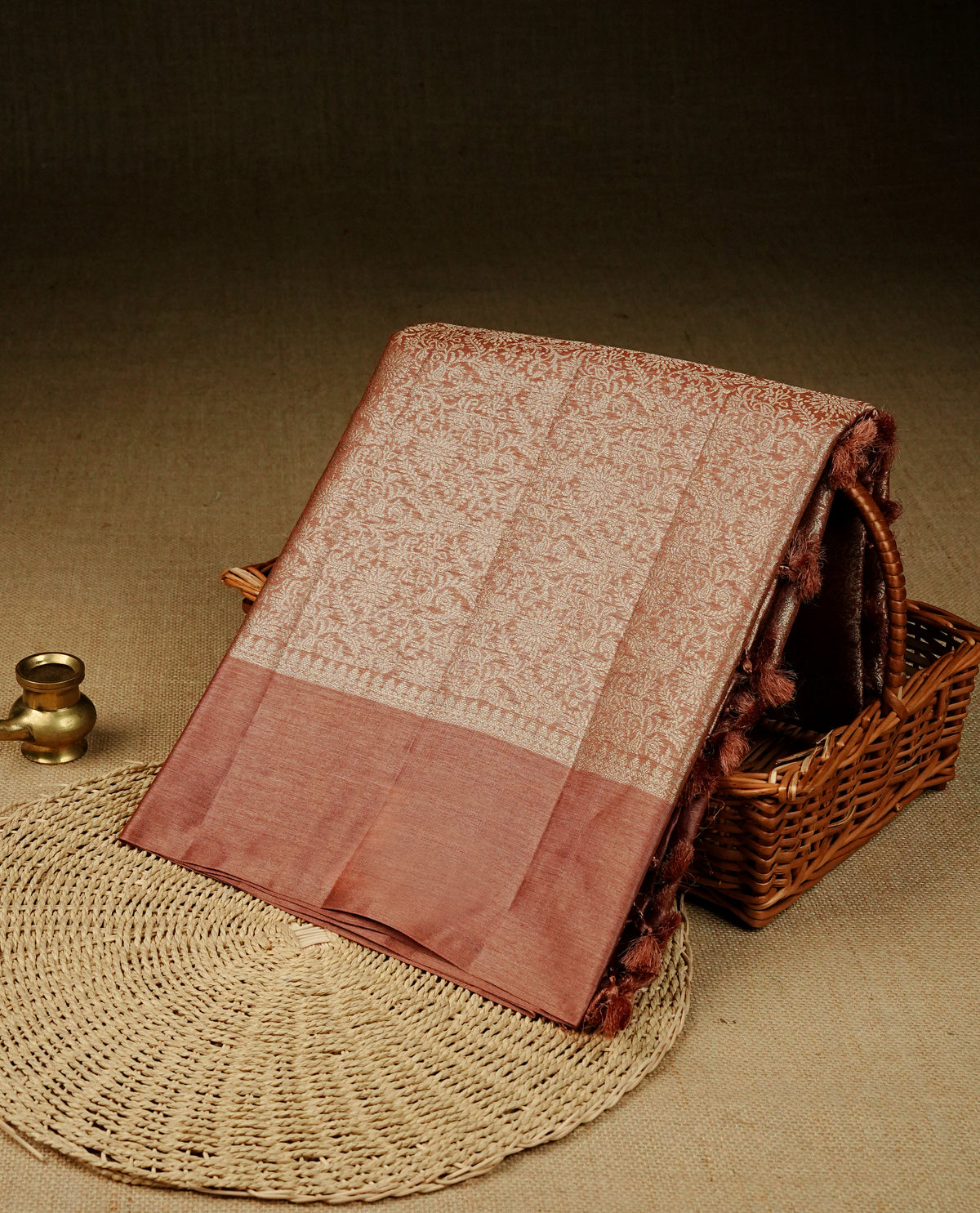 Bronze Colour banaras saree featuring Light gold zari Floral kodi pattern on body, complemented by borderless finish, comes with matching blouse piece.