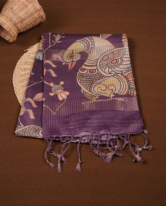 Purple colour semi-tussar silk saree featuring intricate peacock motifs on the pallu, subtle zari check pattern across the body, floral vine prints throughout, finished with tassels and paired with a matching printed blouse piece.