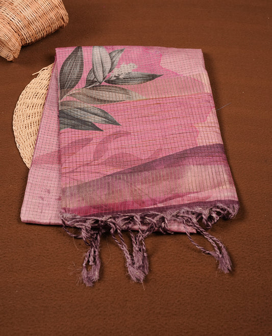 Pink colour semi tussar silk saree featuring floral print across body, contrast pink colour border and pallu, paired with matching blouse piece.