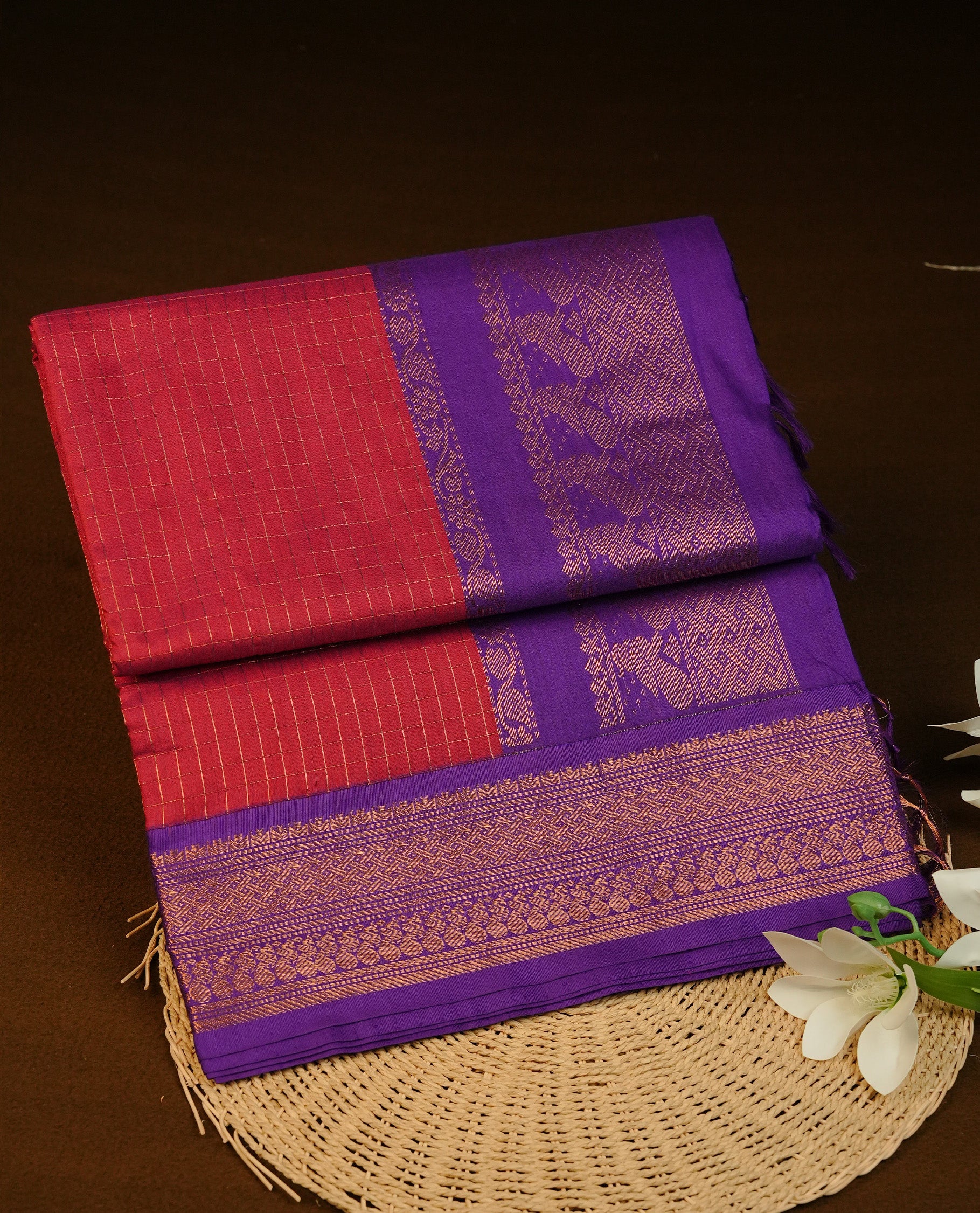 Maroon colour Kalyani cotton saree featuring Gold zari check pattern on body, complemented by Contrast Violet colour with grand gold zari border & pallu, matching blouse piece