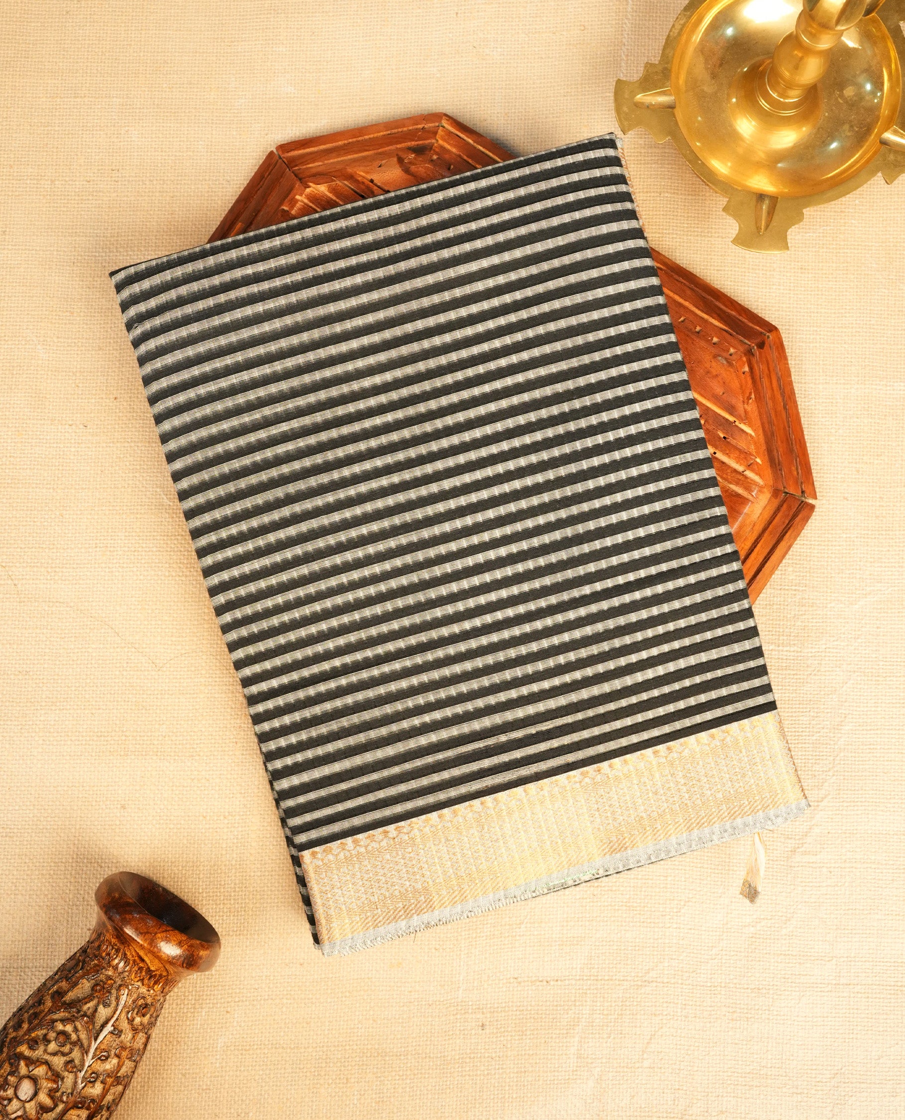 Black  Colour Mangalagiri cotton saree featuring elegant Grey stripes Across The Body , a Two Inch Gold  zari border & Gold Zari Pallu, Paired With a matching blouse piece.