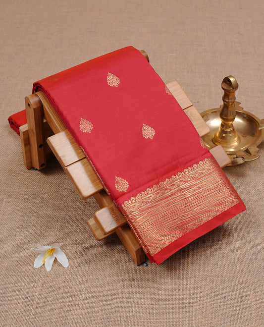 Red Semi Wedding Silk Saree featuring Gold Zari Motifs On body, Complemented with traditional zari with Self colour border, paired with matching blouse piece.