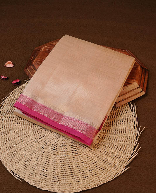 Cream colour Tussar silk saree Featuring Elegant Plain body, complemented by Contrast Magenta colour with gold zari border, paired with matching blouse piece.